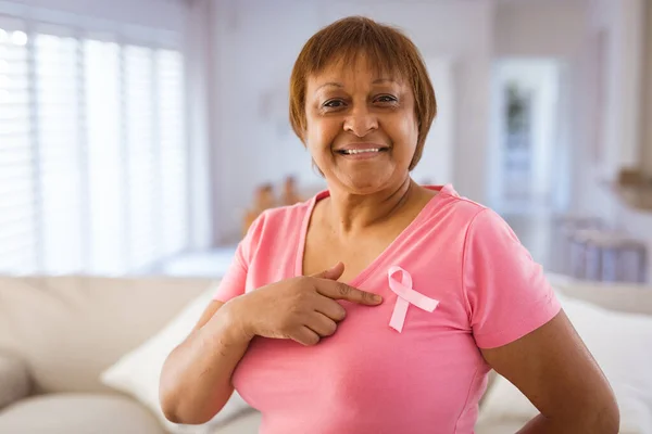 African American Senior Woman Pointing Breast Cancer Awareness Ribbon Pink — Stockfoto