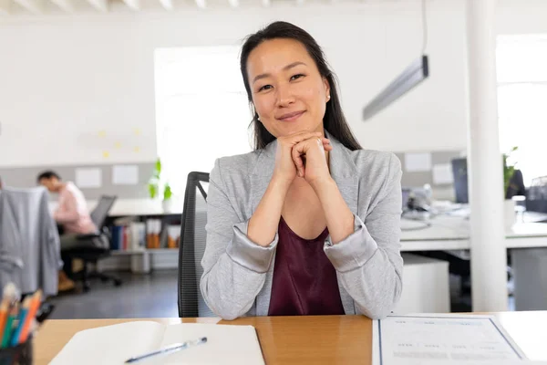 Portrait Confident Asian Creative Businesswoman Sitting Hands Chin Desk Office — Stock Photo, Image