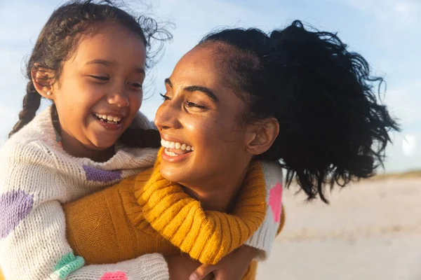 Cheerful Young Biracial Woman Looking Daughter While Giving Her Piggyback — Stock Photo, Image