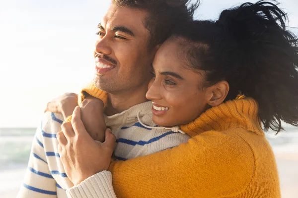 Smiling Biracial Young Woman Embracing Boyfriend While Looking Away Beach — Stock Photo, Image