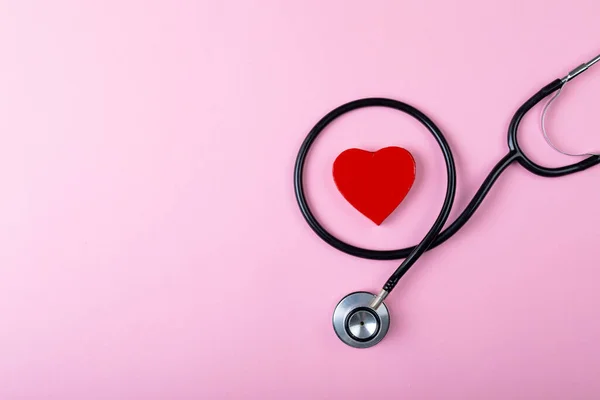 Overhead View Stethoscope Heart Shaped Decoration Pink Background Copy Space — Stock Photo, Image