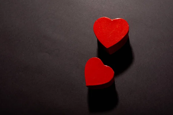 Overhead View Two Red Heart Shapes Shadows Copy Space Black — Stock Photo, Image