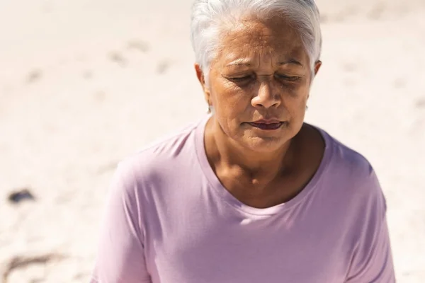 Biracial Senior Woman Meditating Eyes Closed Beach Sunny Day Aktivní — Stock fotografie