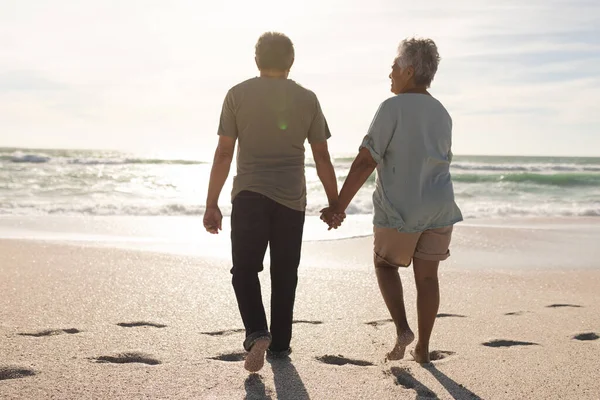Full Length Rear View Senior Multiracial Couple Holding Hands Walking — Stock Photo, Image