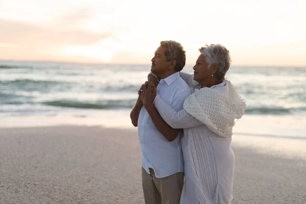 Side View Senior Multiracial Couple Looking Away While Embracing Beach — Stock Photo, Image