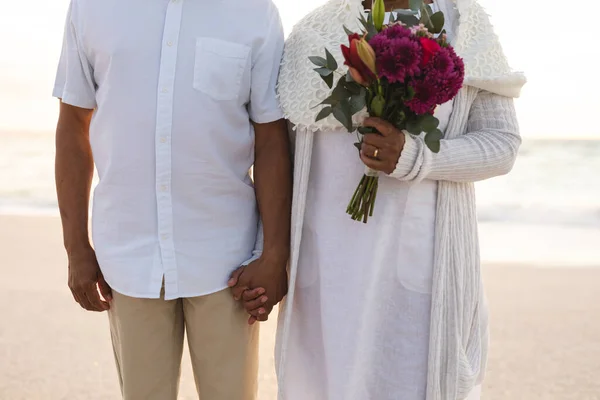 Midsection Biracial Senior Woman Holding Flower Bouquet Man Hand Beach — Stock Photo, Image