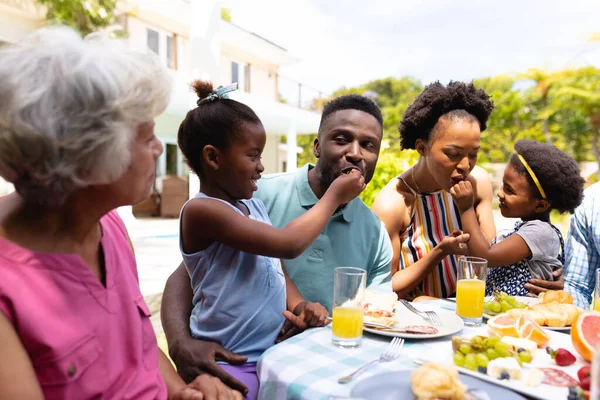 African American Senior Woman Looking Granddaughters Feeding Parents Brunch Family — Stock Photo, Image
