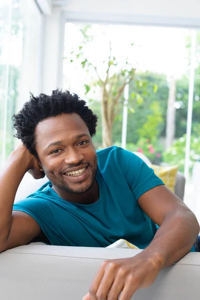 Portrait Young African American Man Sitting Sofa Leaning Head Hand — Stock Photo, Image