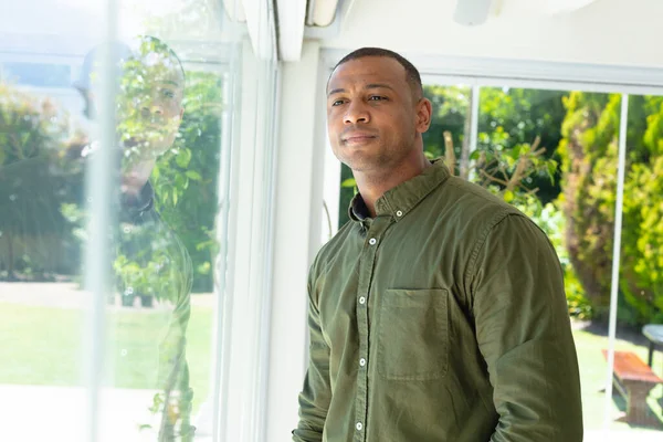 Thoughtful Young African American Man Looking Away While Standing Home — Stock Photo, Image