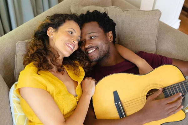 Romantic Young Multiracial Couple Lying Together Sofa Guitar Home People — Stock Photo, Image