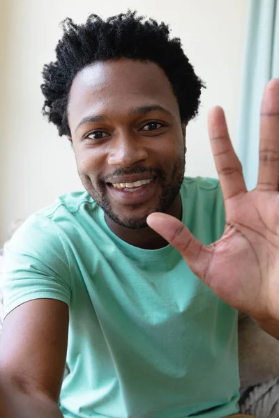 Portrait Smiling Young African American Man Waving Video Call Home — Stock Photo, Image