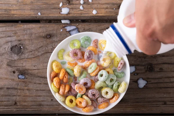 Close View Hand Pouring Milk Bowl Cereal Copy Space Wooden — Stock Photo, Image