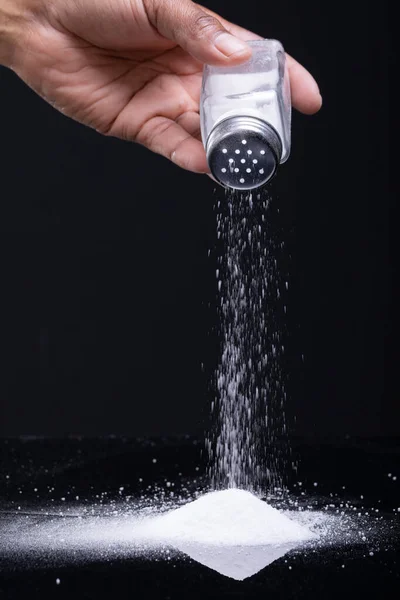 Cropped Hand African American Man Sprinkling Salt Shaker Black Background — Stock Photo, Image