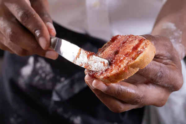 Midsection African American Male Baker Applying Jam Bread Slice Unaltered — Stock Photo, Image