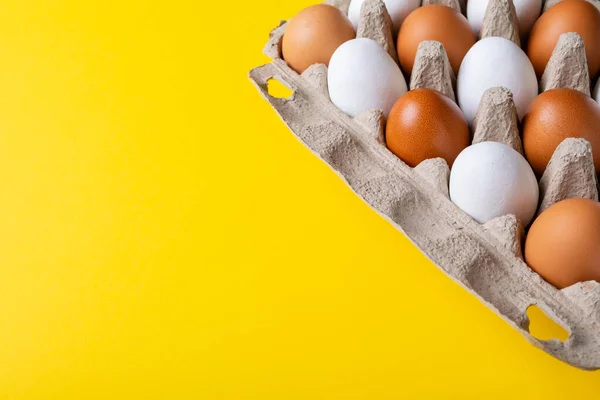 High Angle View Brown White Eggs Egg Carton Yellow Background — Stock Photo, Image