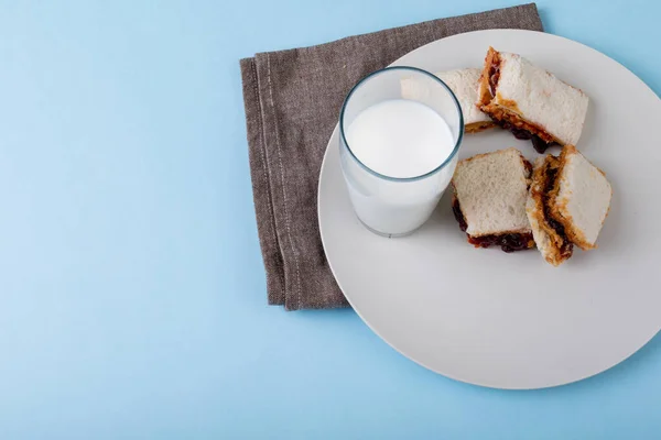 Peanut Butter Jelly Sandwich Slices Served Milk Glass Plate Table — Stock Photo, Image