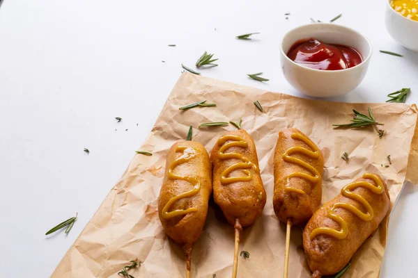 Close Corn Dogs Mustered Sauce Herb Paper Bag Tomato Sauce — Stock Photo, Image