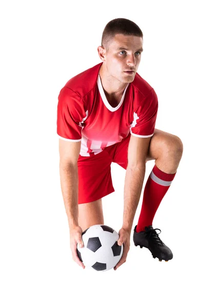 Confident Young Male Caucasian Soccer Player Kneeling While Holding Ball — Stock Photo, Image