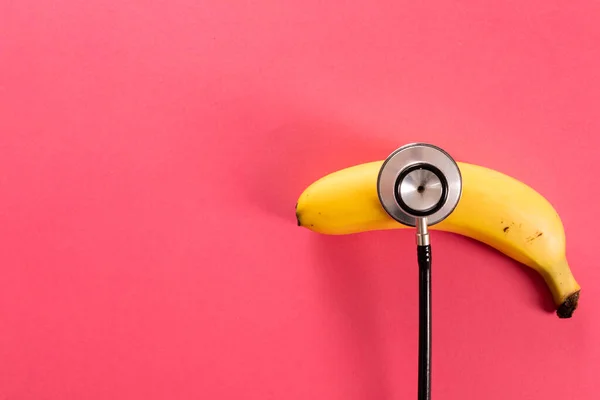 Overhead View Fresh Banana Stethoscope Copy Space Pink Background Unaltered — Stock Photo, Image