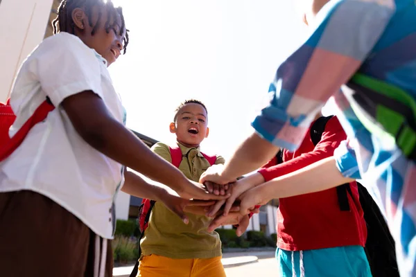 Multiracial Schoolboys Stacking Hands While Standing School Campus Unaltered Childhood — Stock Photo, Image