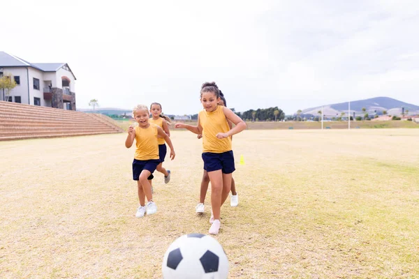 Multiracial Elementary Schoolgirls Running Soccer Ball While Playing Soccer Ground — Stock Photo, Image