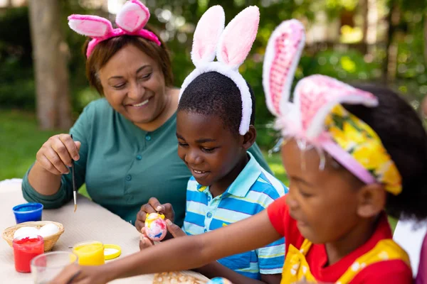 Happy African American Siblings Grandpmother Bunny Ears Painting Easter Eggs — Stock Photo, Image