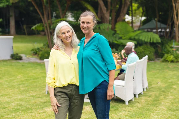Portrait Smiling Caucasian Senior Women Backyard Party Unaltered Lifestyle Leisure — Fotografia de Stock
