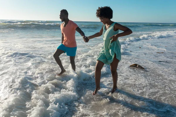 Happy African American Couple Enjoying Summer Holiday Wading Shore Beach — Stock Photo, Image