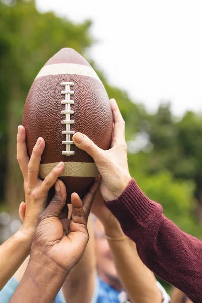 Cropped Image Multiracial Senior Male Female Friends Holding Rugby Ball Stock Photo