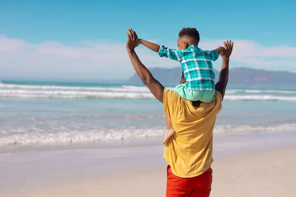 Rear View African American Young Man Arms Raised Carrying Son — 图库照片
