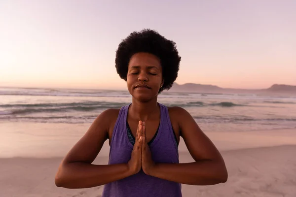 African American Mature Woman Afro Hair Meditating Prayer Pose Sea — Stock Photo, Image