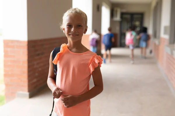 Portrait Smiling Caucasian Elementary Schoolgirl Standing Corridor Unaltered Education Childhood — Stock Photo, Image
