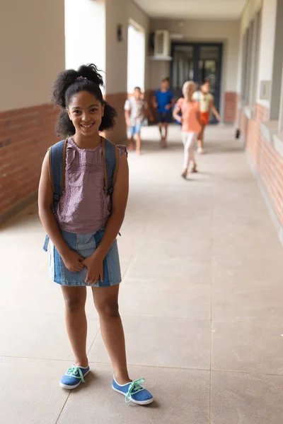 Portrait Smiling Biracial Elementary Schoolgirl Standing Corridor Unaltered Education Childhood — Stock Photo, Image