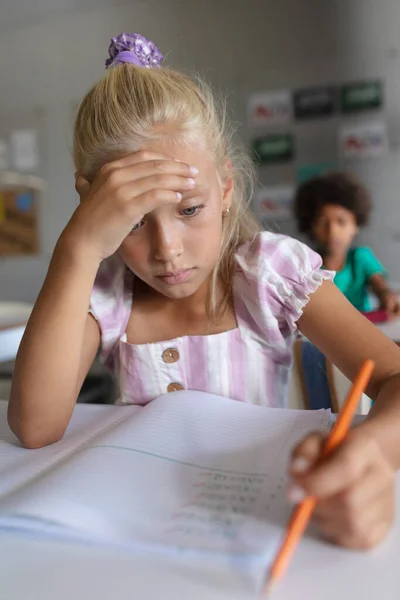Close Caucasian Elementary Schoolgirl Head Hand Studying Desk Classroom Unaltered — Stock Photo, Image