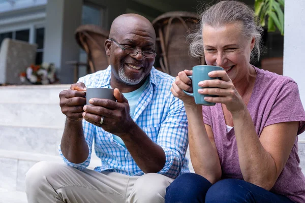 Happy Multiracial Senior Couple Having Coffee Together While Sitting Steps — Stock Photo, Image