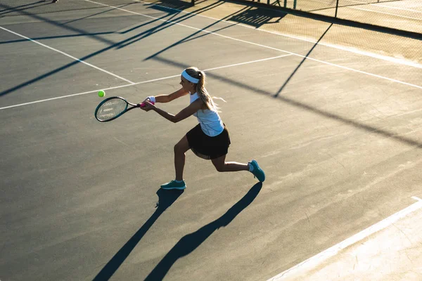 High Angle View Young Female Caucasian Tennis Player Hitting Ball — стоковое фото