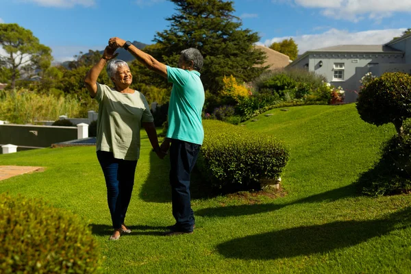 Romantic Biracial Senior Couple Holding Hands Dancing Park Sky Sunny — Stock fotografie