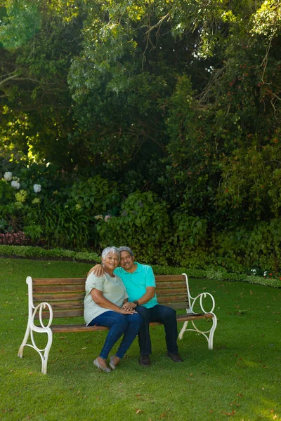 Portrait Smiling Biracial Senior Man Wife Sitting Bench Trees Plants — ストック写真