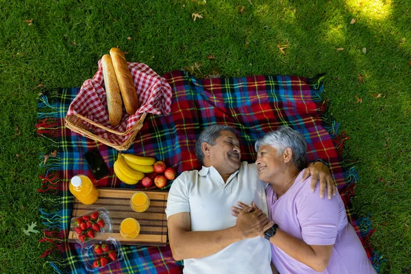 High Angle View Smiling Biracial Senior Couple Food Drink Lying — Stok fotoğraf