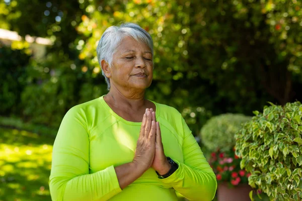 Biracial Senior Woman Short Hair Meditating Eyes Closed Prayer Position — Stock fotografie