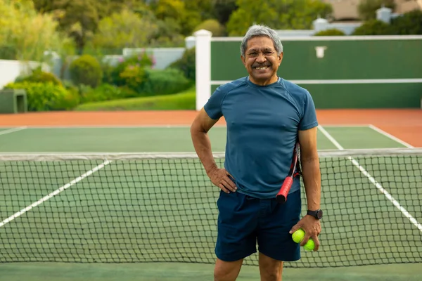 Portrait Happy Biracial Senior Man Hand Hip Holding Balls Racket — Stock Fotó