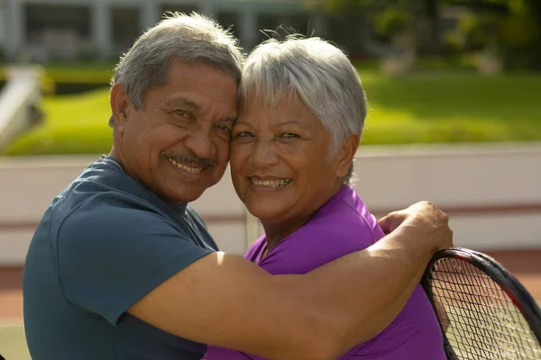 Close Portrait Smiling Biracial Senior Husband Embracing Senior Wife Tennis — Foto de Stock