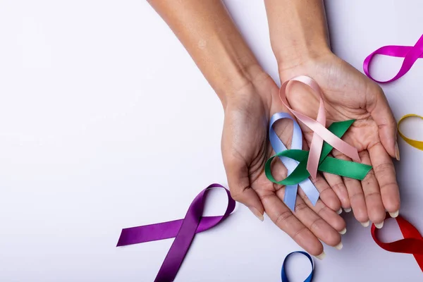 Close Woman Hands Colorful Awareness Ribbons Copy Space White Background — Foto Stock