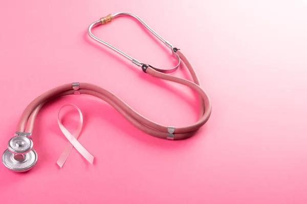 High Angle View Stethoscope Breast Cancer Awareness Ribbon Pink Background — Foto Stock