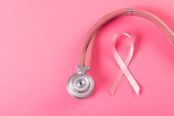 Close Pink Breast Cancer Awareness Ribbon Stethoscope Pink Background Copy — Zdjęcie stockowe