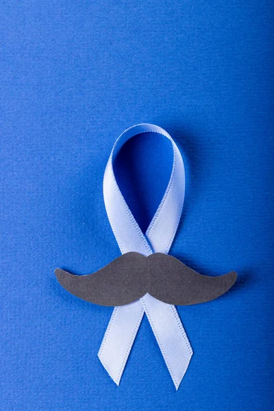 Close Blue Prostate Cancer Awareness Ribbon Paper Mustache Blue Background — Fotografia de Stock