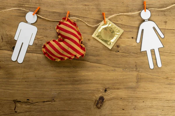 Close Paper Couple Heart Shape Condom Hanging Clothesline Wooden Table — Stock fotografie