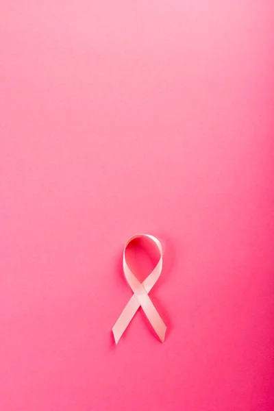 Overhead View Pink Breast Cancer Awareness Ribbon Isolated Pink Background — Fotografia de Stock