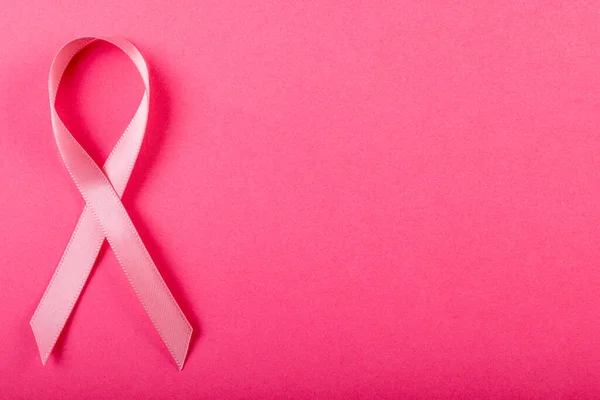 Overhead View Pink Breast Cancer Awareness Ribbon Isolated Pink Background — Stockfoto