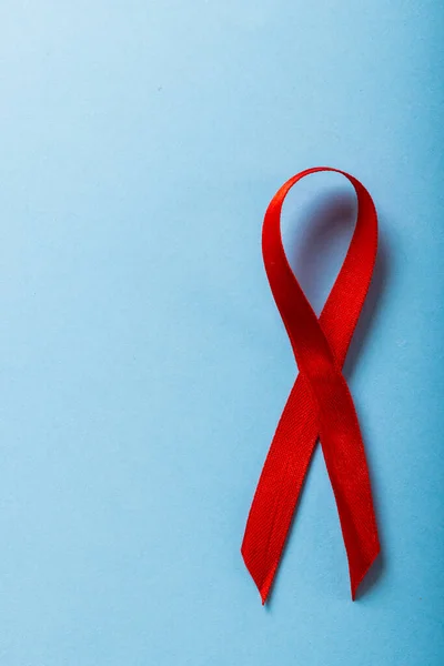 Directly Shot Red Aids Awareness Ribbon Isolated Blue Background Copy — Foto Stock